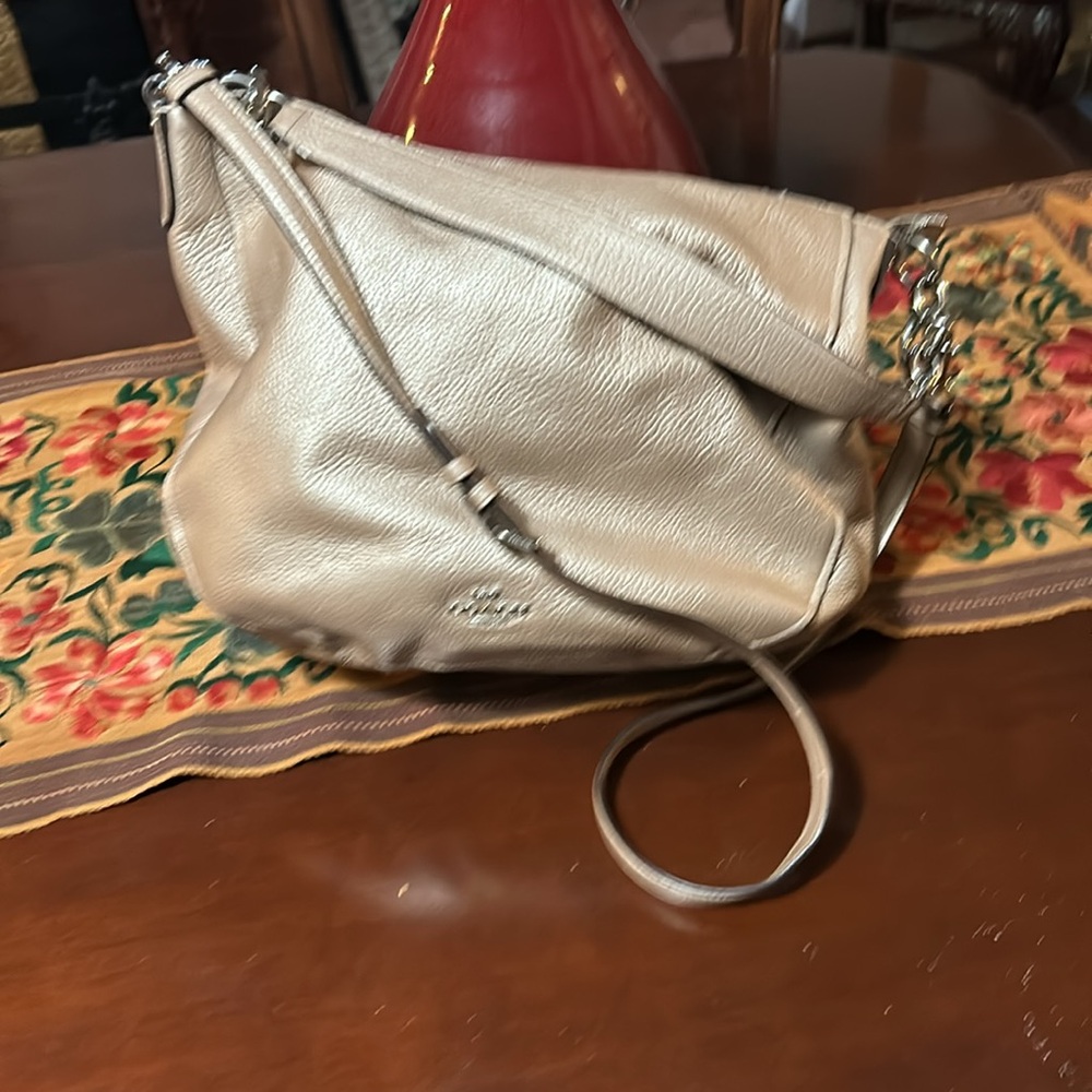 COACH PURSE IN A BEAUTIFUL SILVER TONE.  Hand strap as well as shoulder strap.
